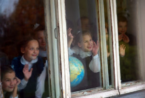 IVANOVO REGION, RUSSIA  SEPTEMBER 28, 2016: Children looking through a window at a secondary school in the village of Blagoveshchenye, Ivanovo Region. The school has just 13 students. Vladimir Smirnov/TASS Ðîññèÿ. Èâàíîâñêàÿ îáëàñòü. 3 îêòÿáðÿ 2016. Ó÷åíèêè Áëàãîâåùåíñêîé îñíîâíîé îáùåîáðàçîâàòåëüíîé øêîëû, ãäå îáó÷àåòñÿ 13 äåòåé. Âëàäèìèð Ñìèðíîâ/ÒÀÑÑ